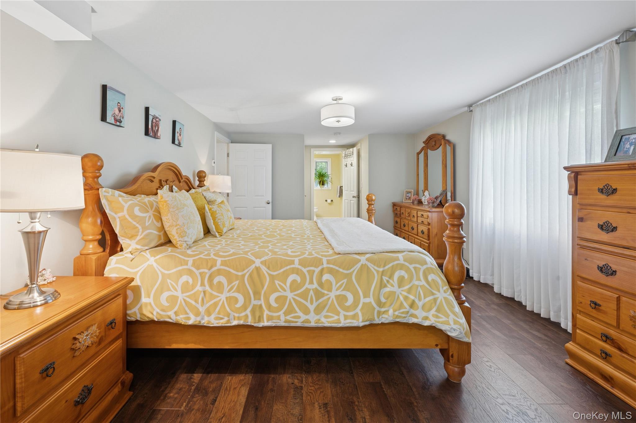 123 Pleasant Road Lake Peekskill, NY 10537 - Photo 16 of 50 a bedroom with a bed and wooden floor