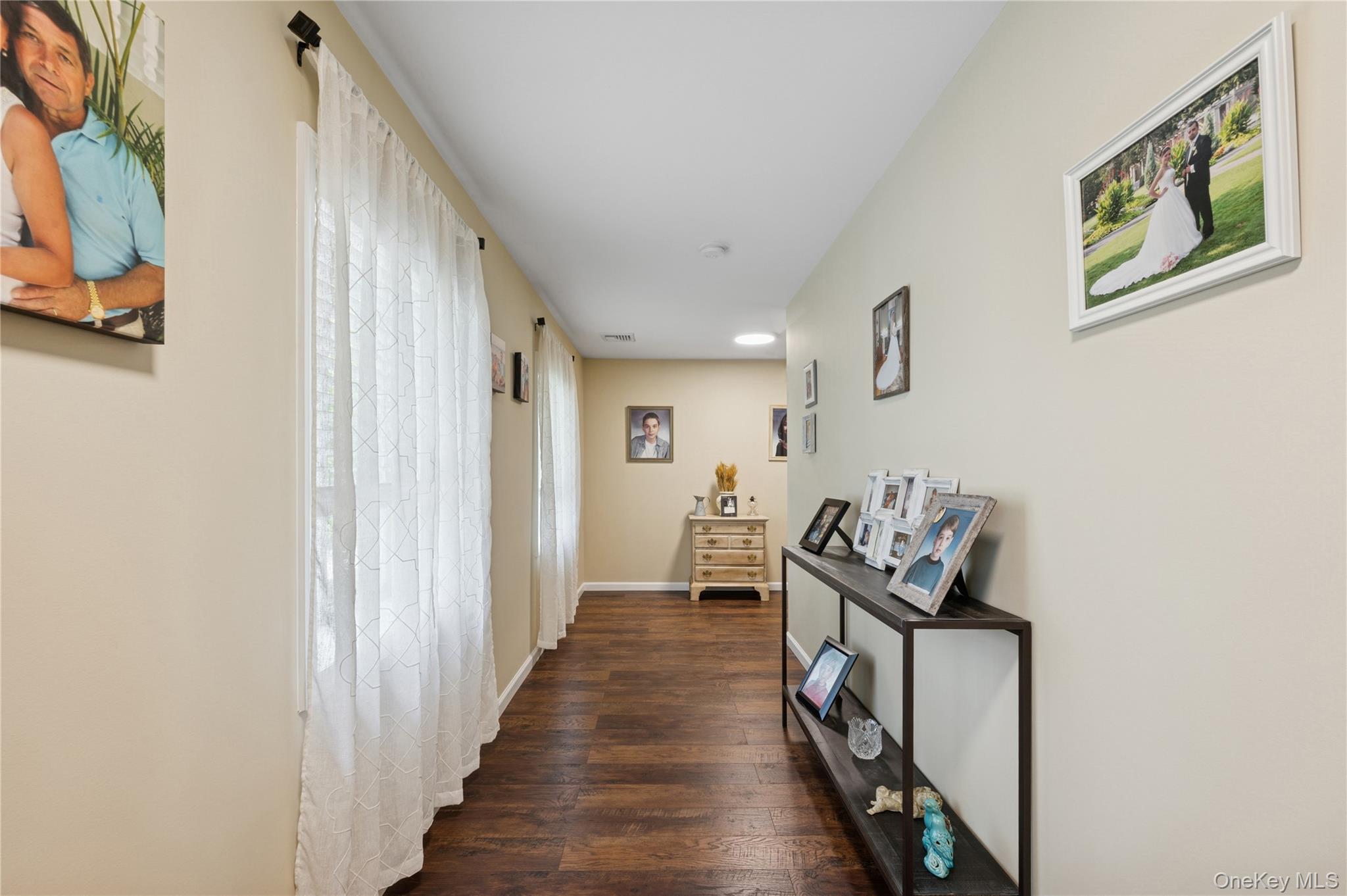 123 Pleasant Road Lake Peekskill, NY 10537 - Photo 2 of 50 a view of a hallway to a livingroom with furniture and stairs