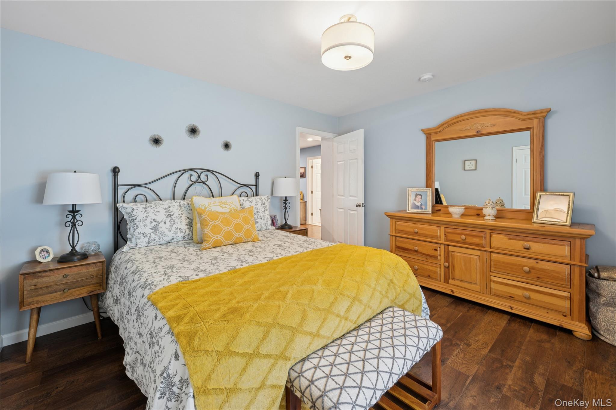 123 Pleasant Road Lake Peekskill, NY 10537 - Photo 26 of 50 a bedroom with a bed and wooden floor