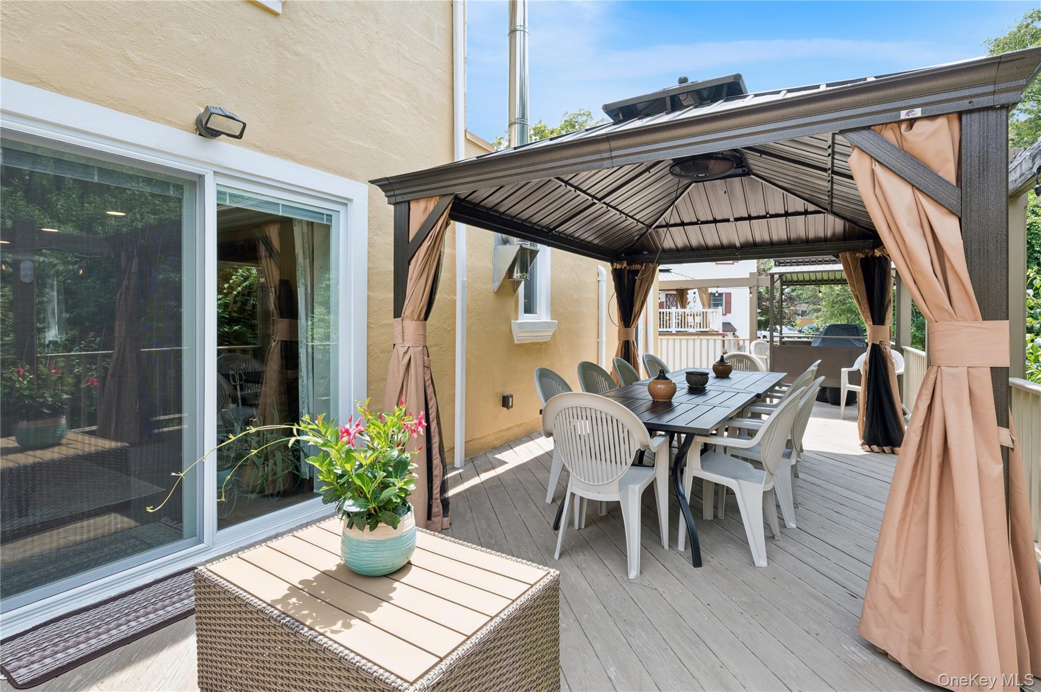 123 Pleasant Road Lake Peekskill, NY 10537 - Photo 27 of 50 a view of a patio with table and chairs and potted plants