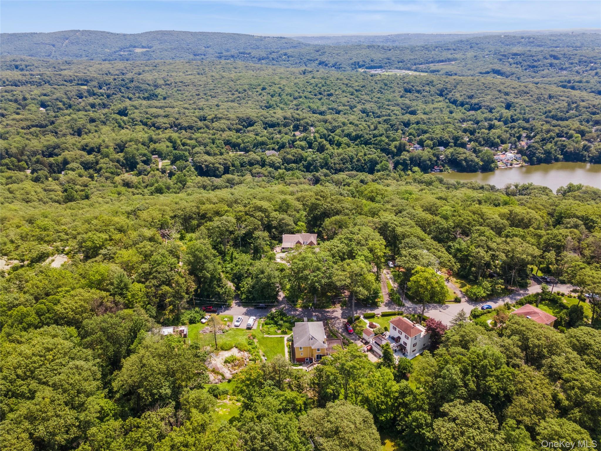 123 Pleasant Road Lake Peekskill, NY 10537 - Photo 31 of 50 an aerial view of residential house with outdoor space and trees all around