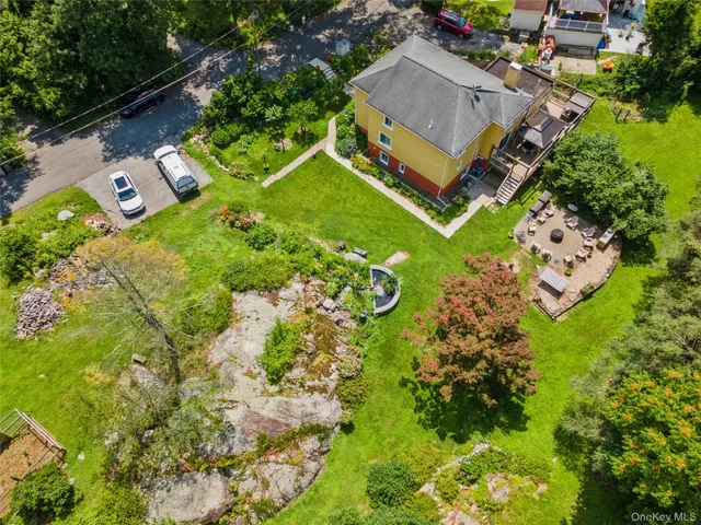 an aerial view of a house with a garden