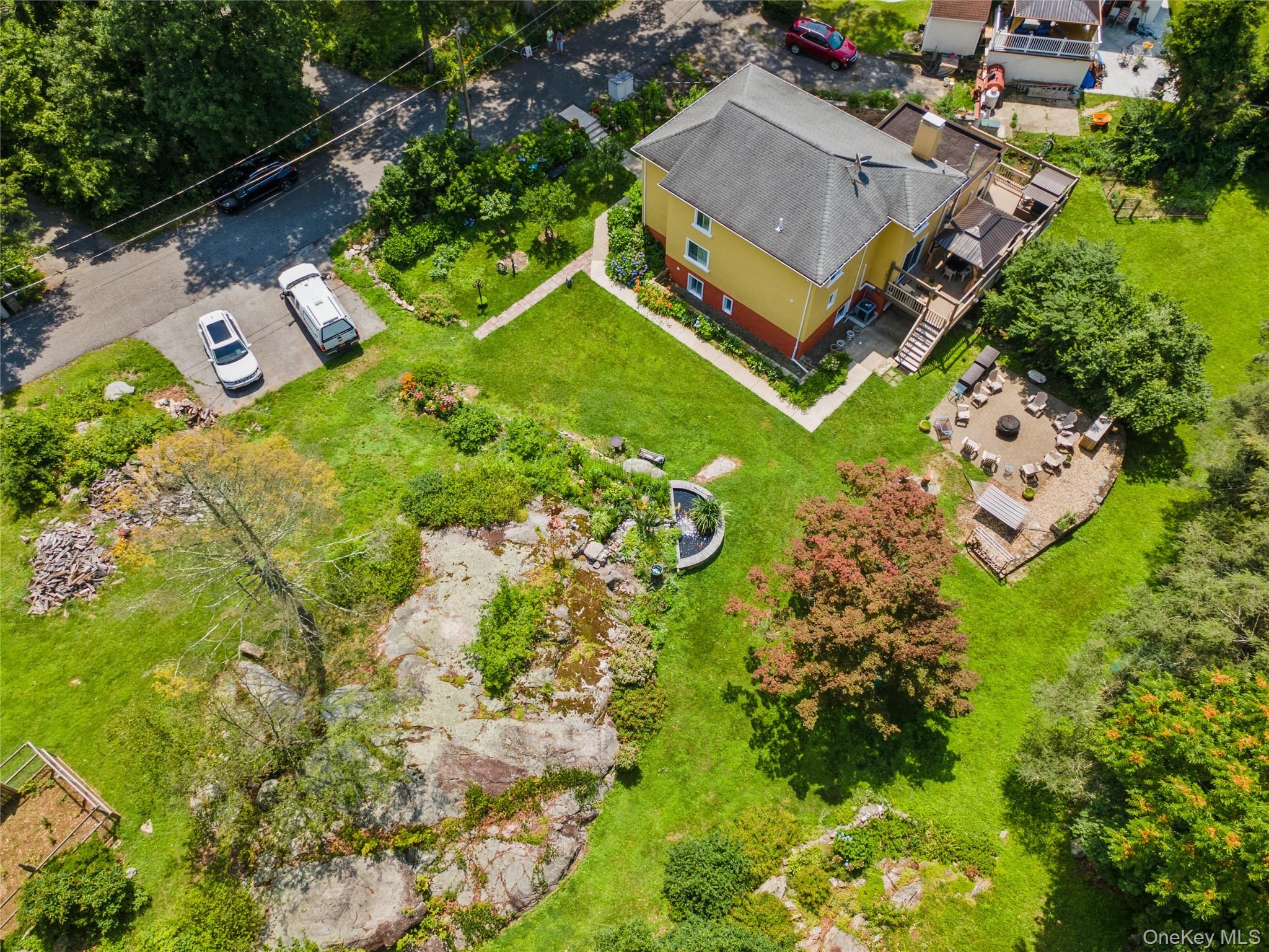 123 Pleasant Road Lake Peekskill, NY 10537 - Photo 33 of 50 an aerial view of a house with a garden