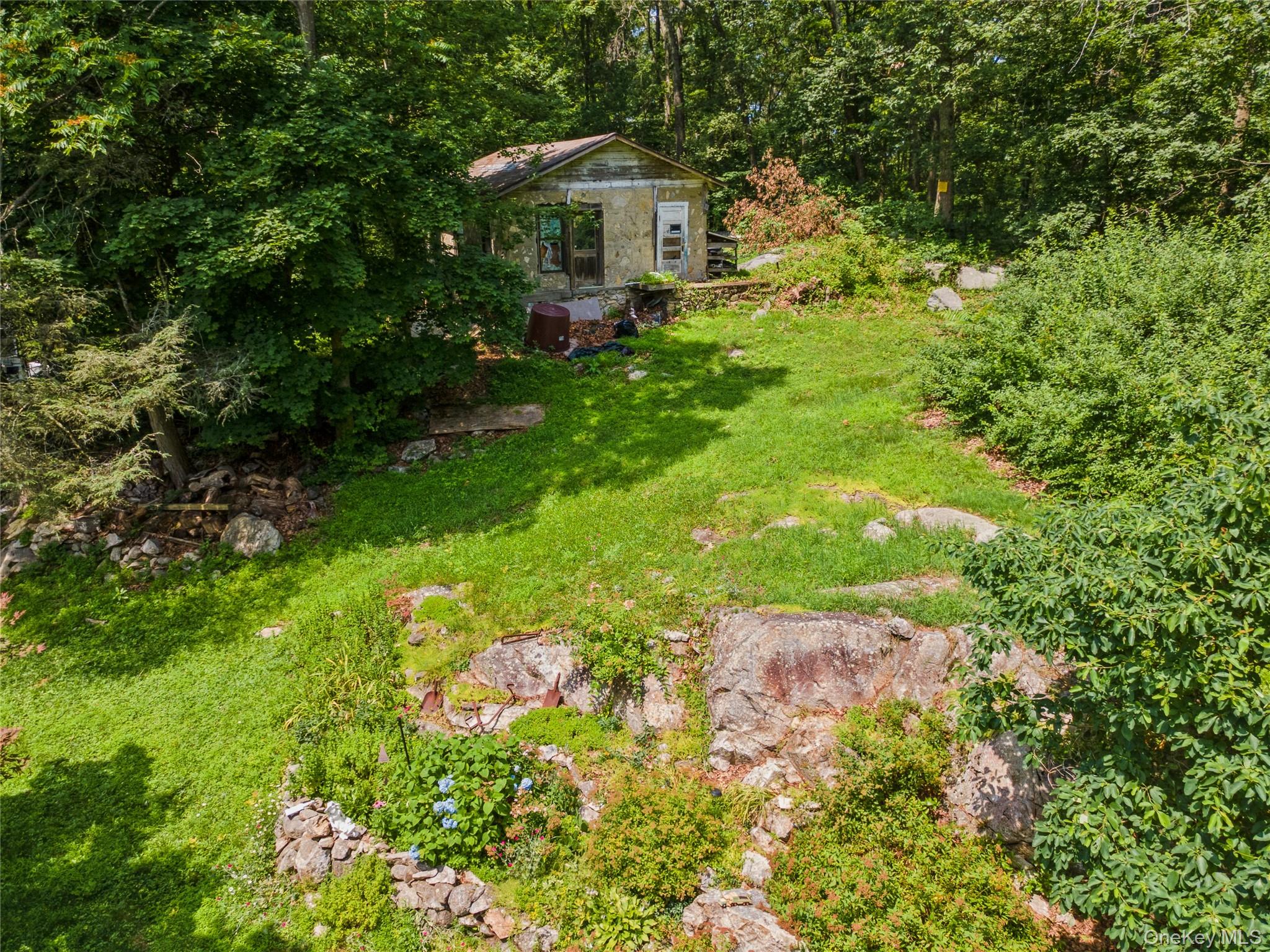 123 Pleasant Road Lake Peekskill, NY 10537 - Photo 34 of 50 a front view of a house with garden