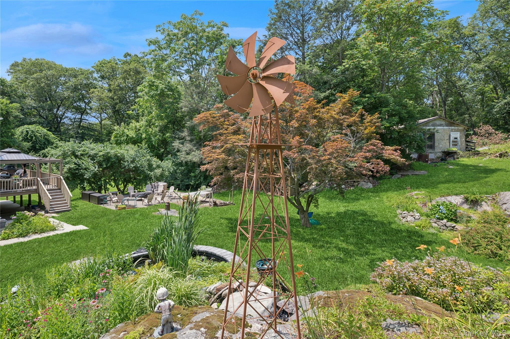 123 Pleasant Road Lake Peekskill, NY 10537 - Photo 35 of 50 a backyard of a house with lots of green space