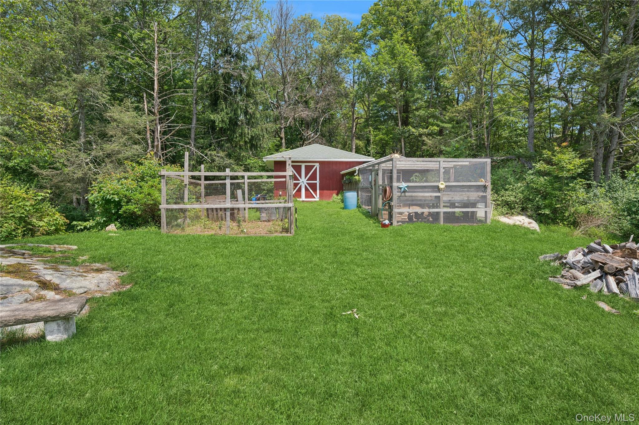 123 Pleasant Road Lake Peekskill, NY 10537 - Photo 36 of 50 a view of a house with a backyard porch and sitting area