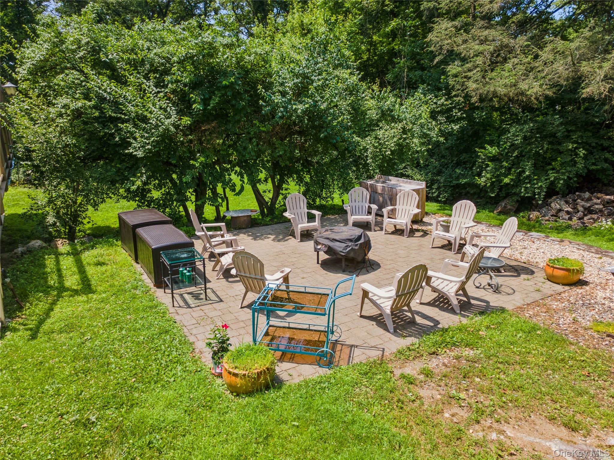 123 Pleasant Road Lake Peekskill, NY 10537 - Photo 43 of 50 a view of a backyard with sitting area