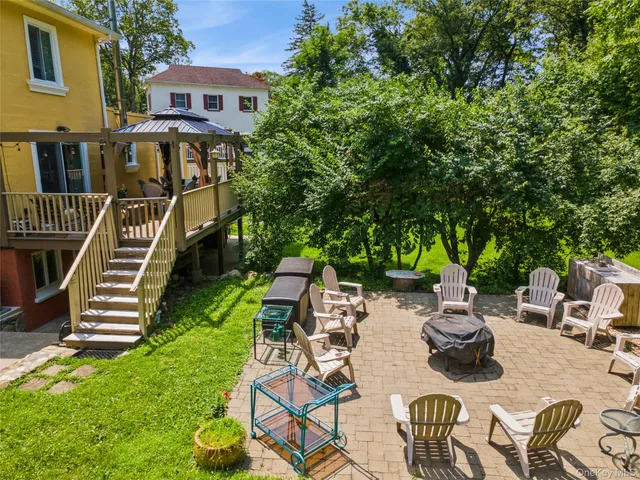 an outdoor space with furniture and garden