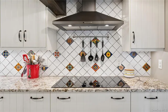 a utility room with a stove a sink and dishwasher