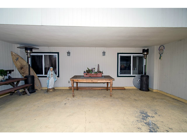 413 Lewis Lane Pacifica, CA 94044 - Photo 12 of 13 a living room with furniture a rug and a piano