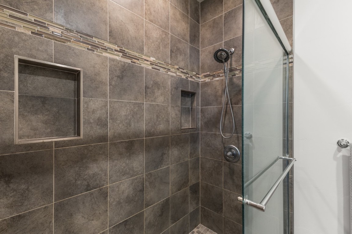984 Dry Creek Road Hayden, CO 81639 - Photo 21 of 30 a bathroom with a glass door shower