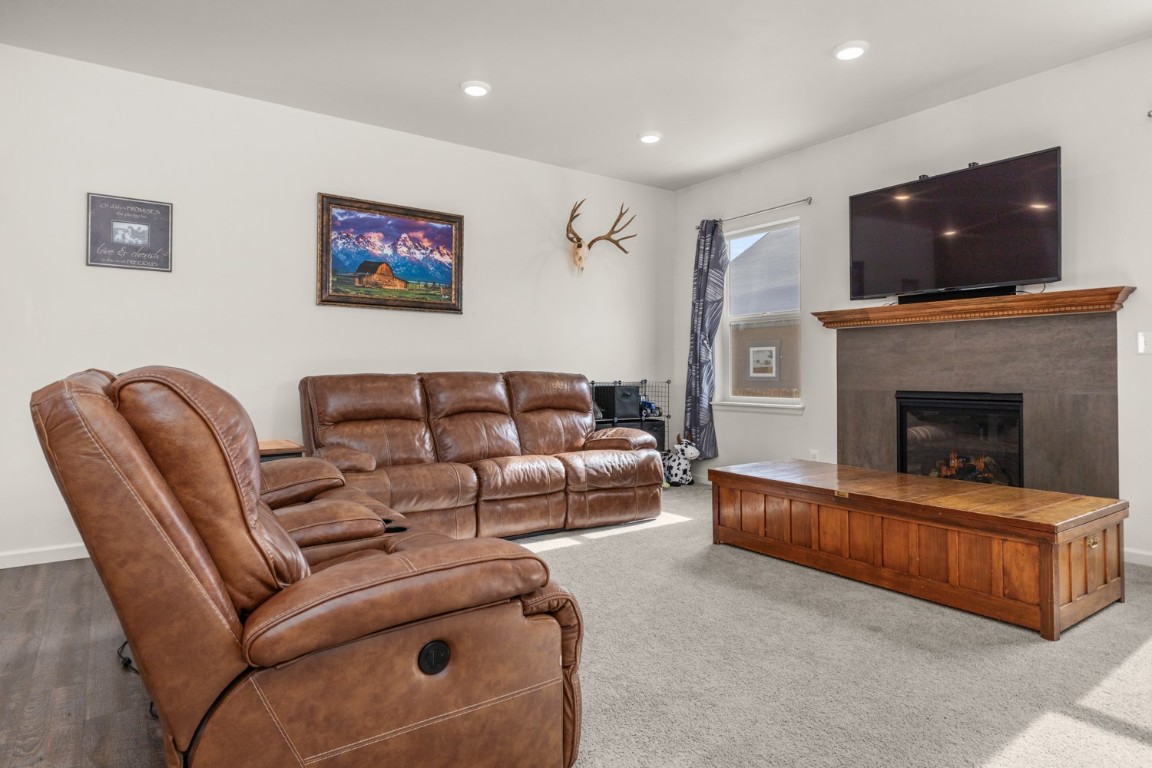 984 Dry Creek Road Hayden, CO 81639 - Photo 5 of 30 a living room with furniture and a fireplace