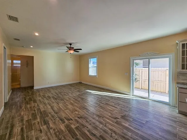 a kitchen with granite countertop a counter space a sink appliances and cabinets