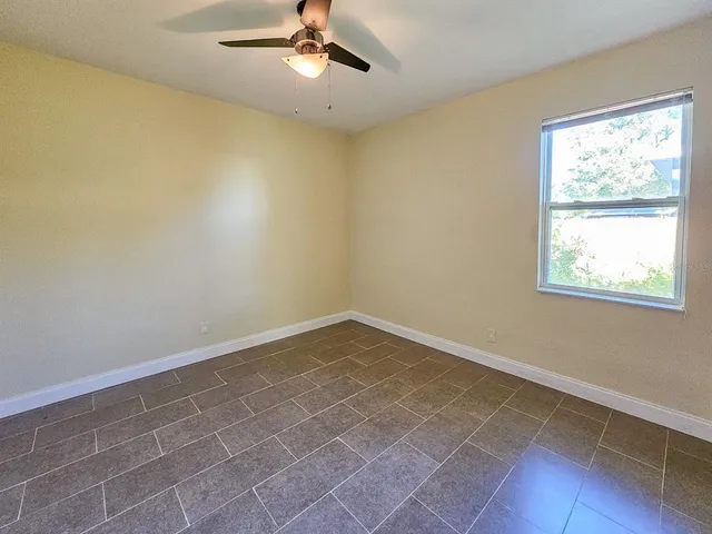a view of a patio with couches table and chairs and potted plants