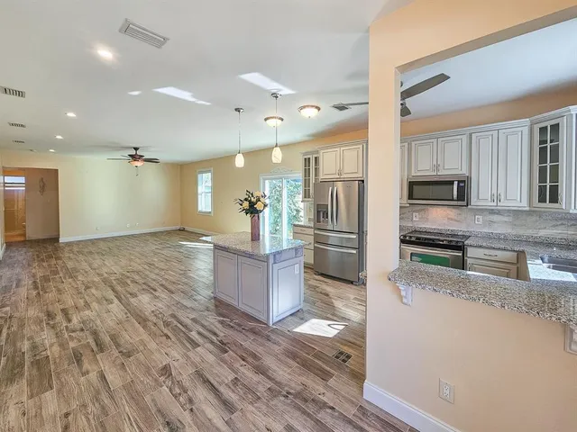 a view of living room with wooden floor