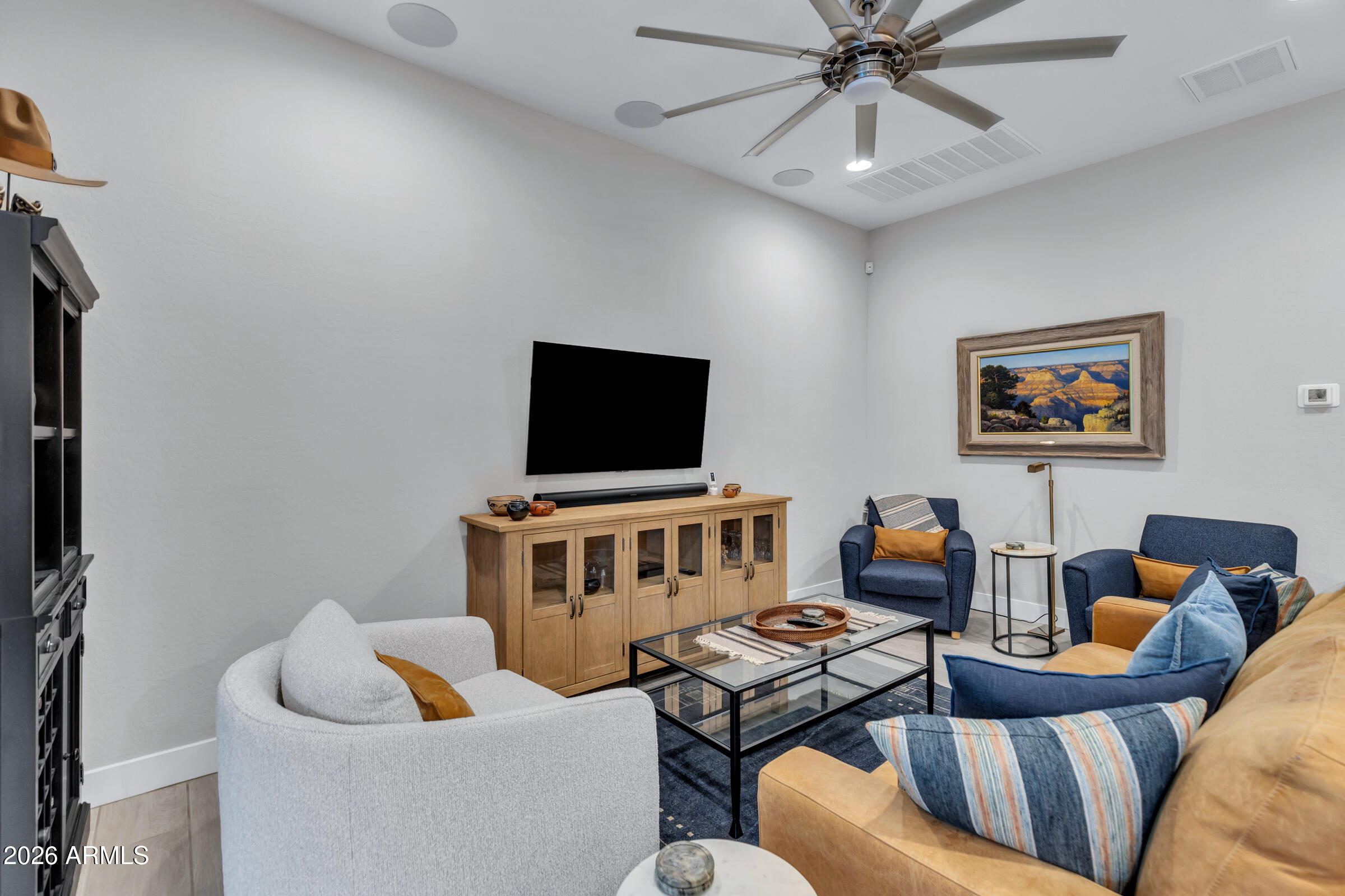 622 West Deer Creek Road Phoenix, AZ 85048 - Photo 14 of 39 a living room with furniture and a flat screen tv