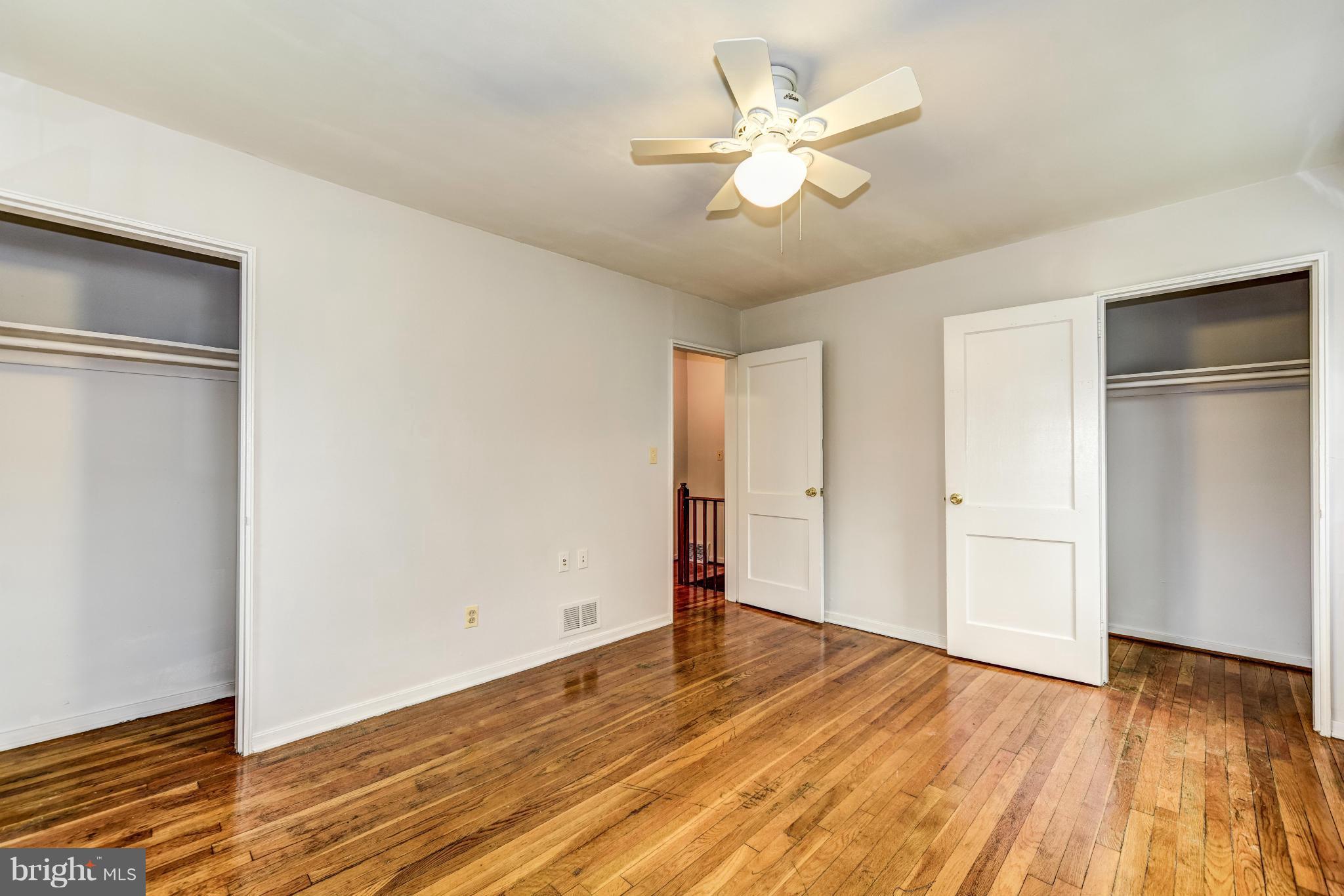 12036 Claridge Road Silver Spring, MD 20902 - Photo 15 of 27 a view of a room with wooden floor and ceiling fan