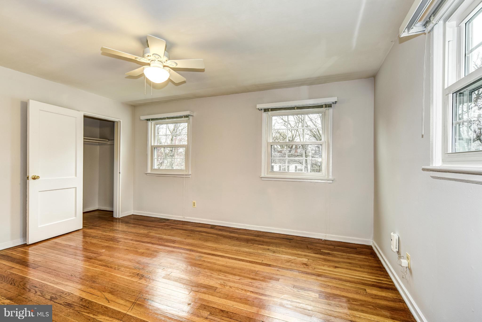 12036 Claridge Road Silver Spring, MD 20902 - Photo 16 of 27 a view of an empty room with wooden floor and a window
