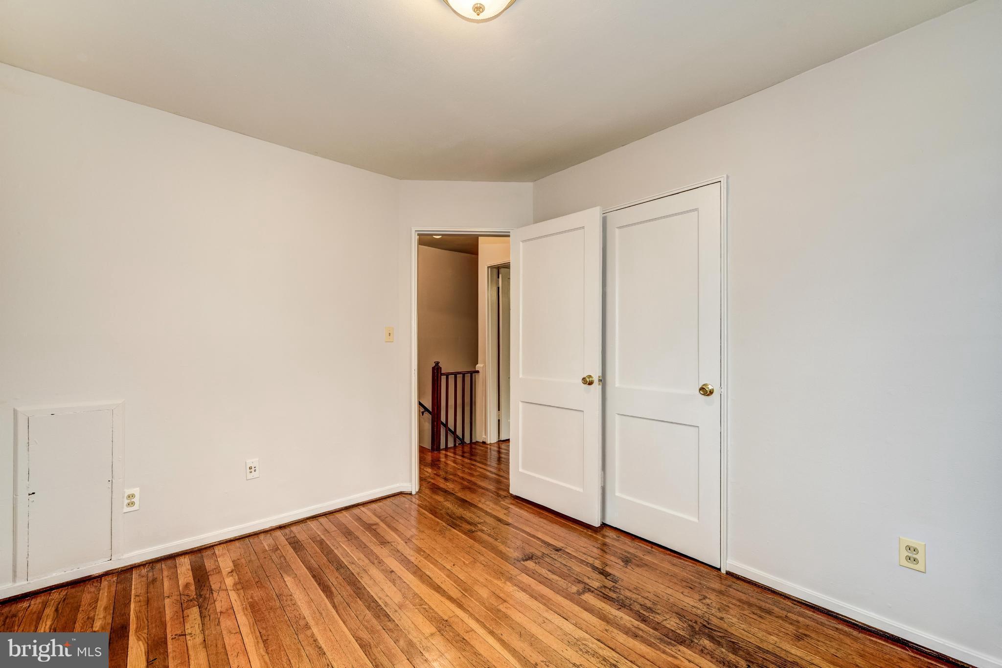 12036 Claridge Road Silver Spring, MD 20902 - Photo 18 of 27 a view of an empty room with wooden floor