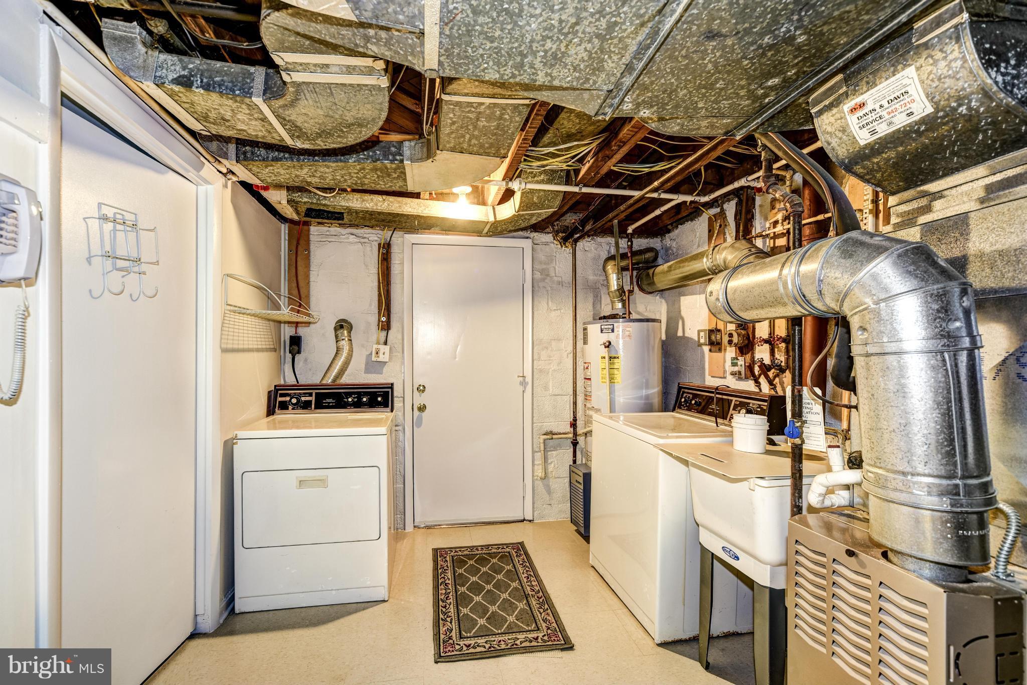 12036 Claridge Road Silver Spring, MD 20902 - Photo 25 of 27 a utility room with dryer and washer