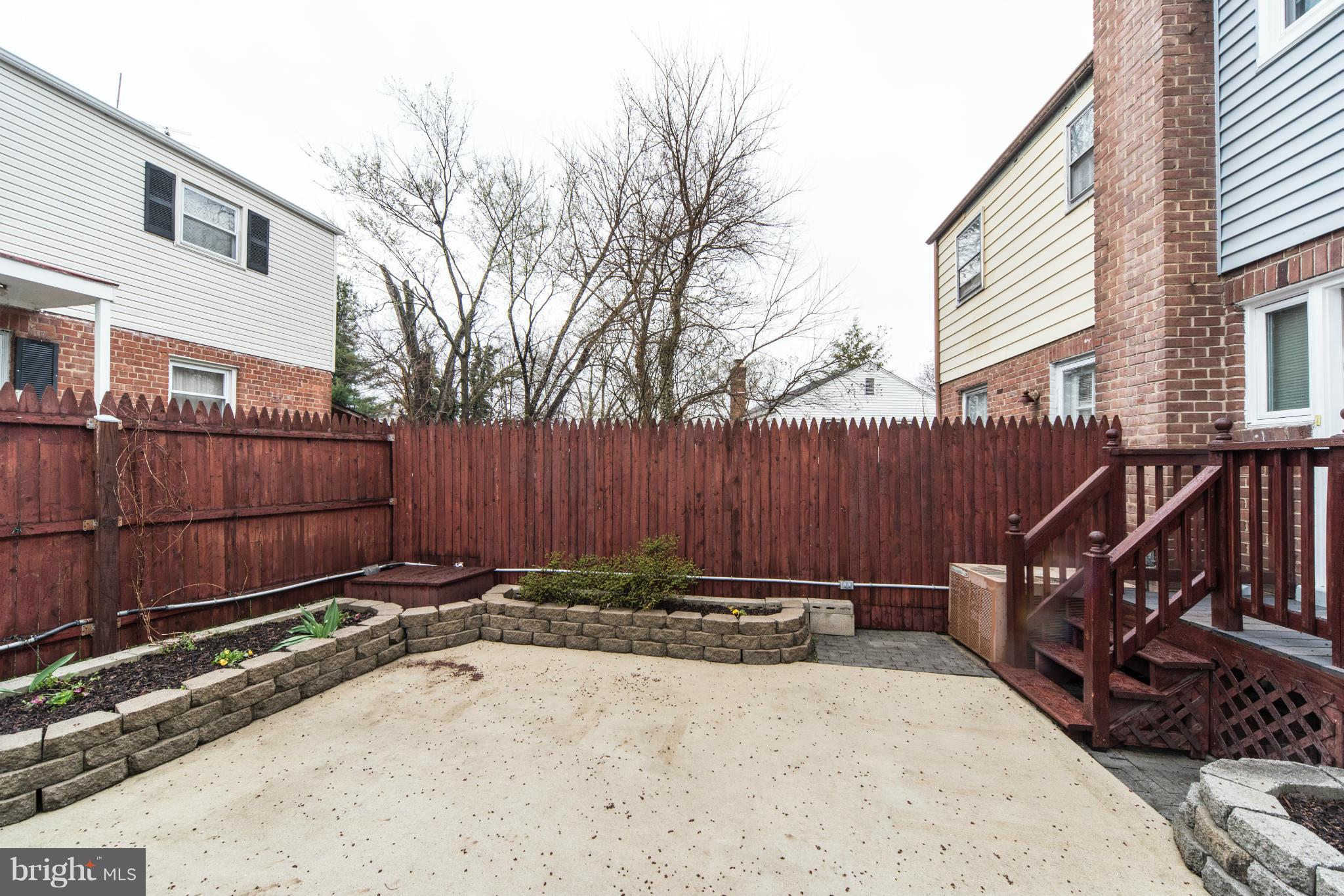 12036 Claridge Road Silver Spring, MD 20902 - Photo 27 of 27 a view of a backyard with wooden fence