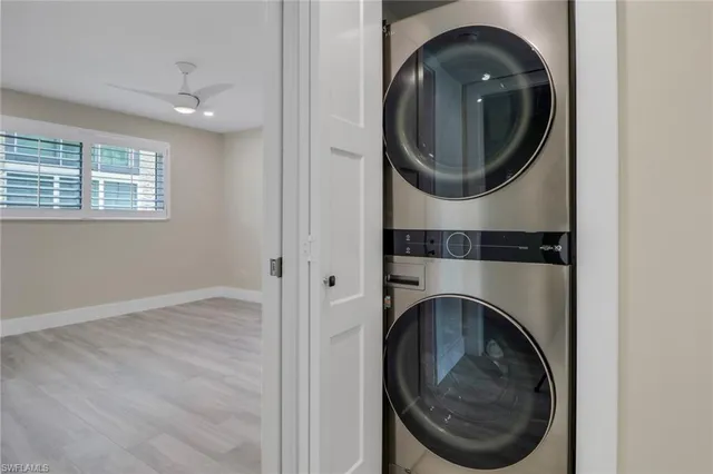 a close view of a utility room with dryer and washer