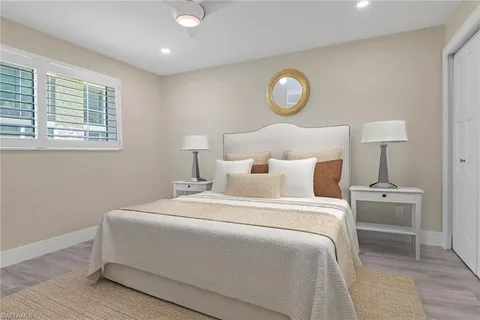 a bedroom with bed and a window