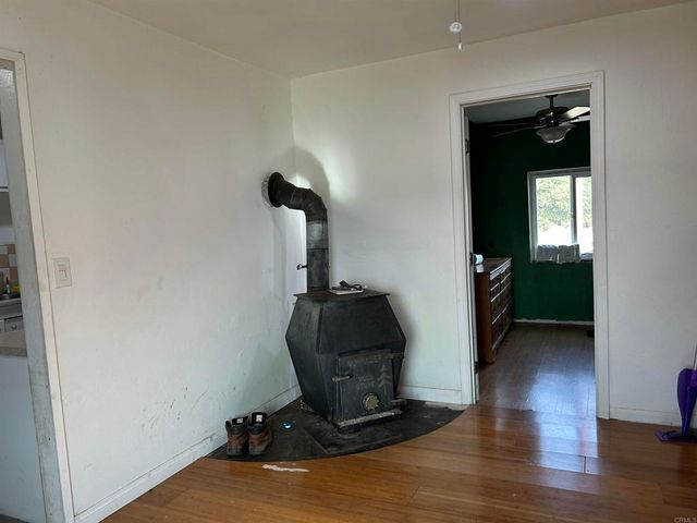a view of a livingroom with furniture and wooden floor