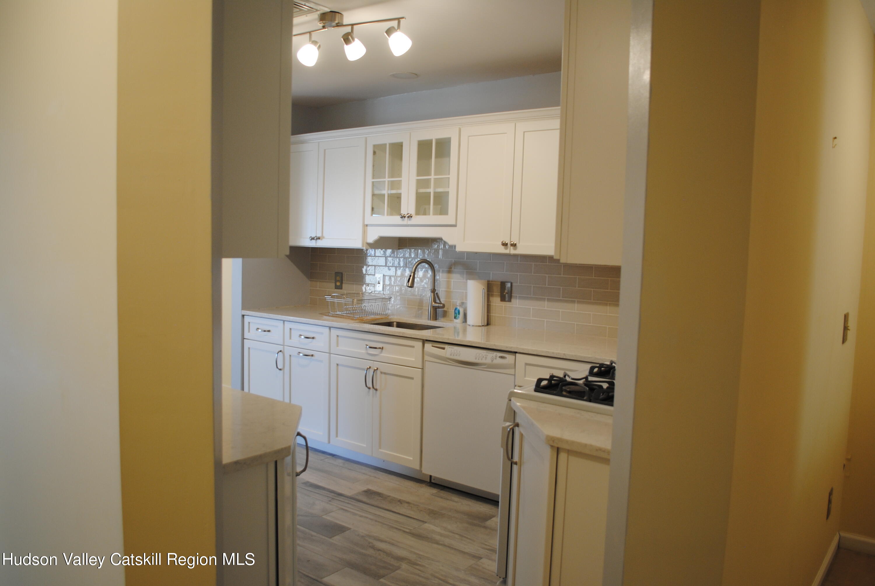 75 Riverview Port Ewen, NY 12466 - Photo 17 of 35 a kitchen with stainless steel appliances granite countertop a sink stove and cabinets