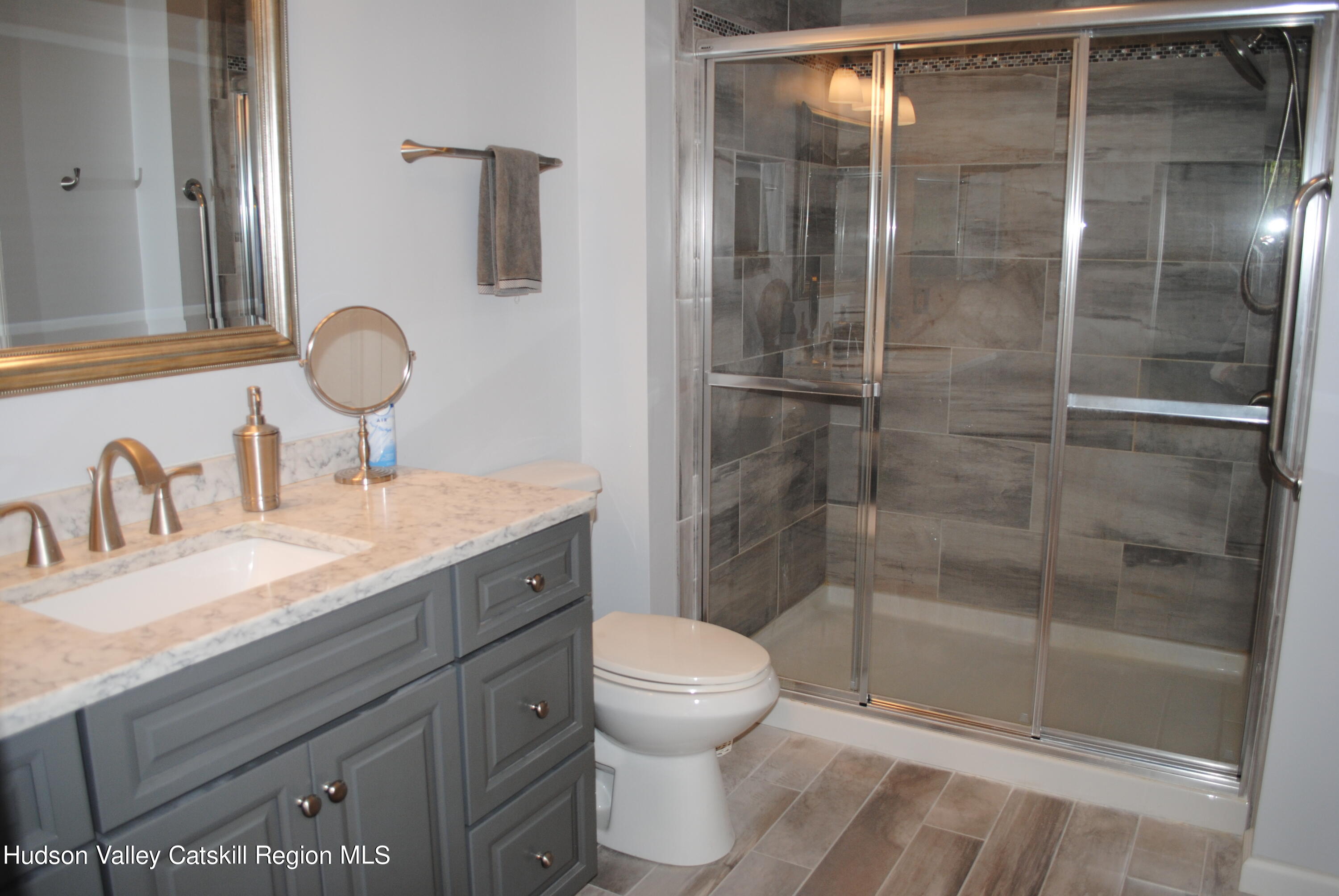 75 Riverview Port Ewen, NY 12466 - Photo 20 of 35 a bathroom with a granite countertop sink toilet and shower