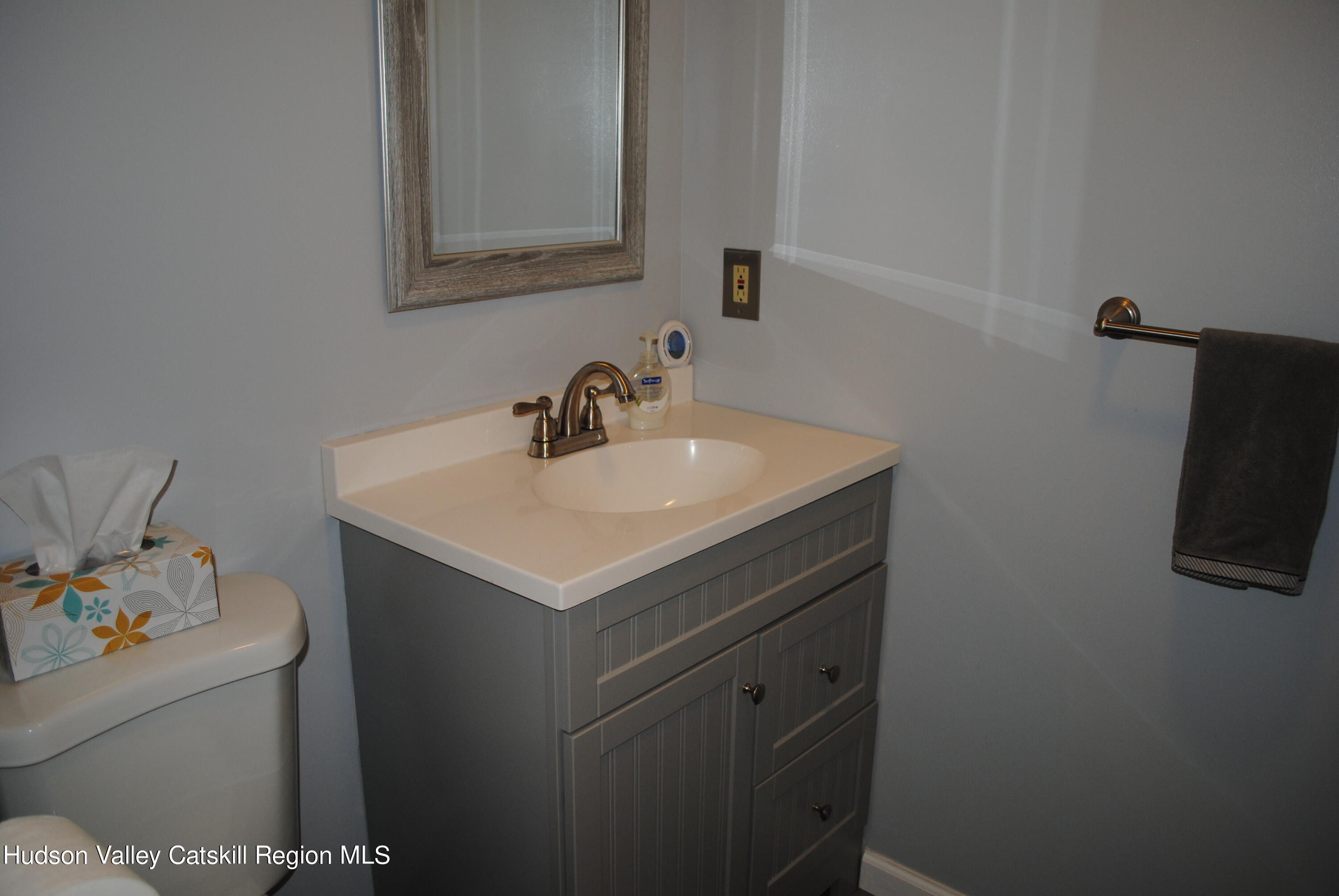 75 Riverview Port Ewen, NY 12466 - Photo 22 of 35 a bathroom with a sink and a mirror
