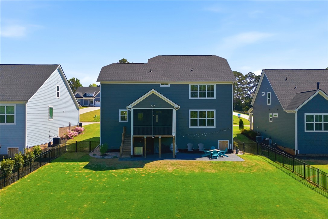 318 Summerall Drive Anderson, SC 29621 - Photo 37 of 42 This residence showcases a large, lush lawn with a charming patio, perfect for outdoor enjoyment.