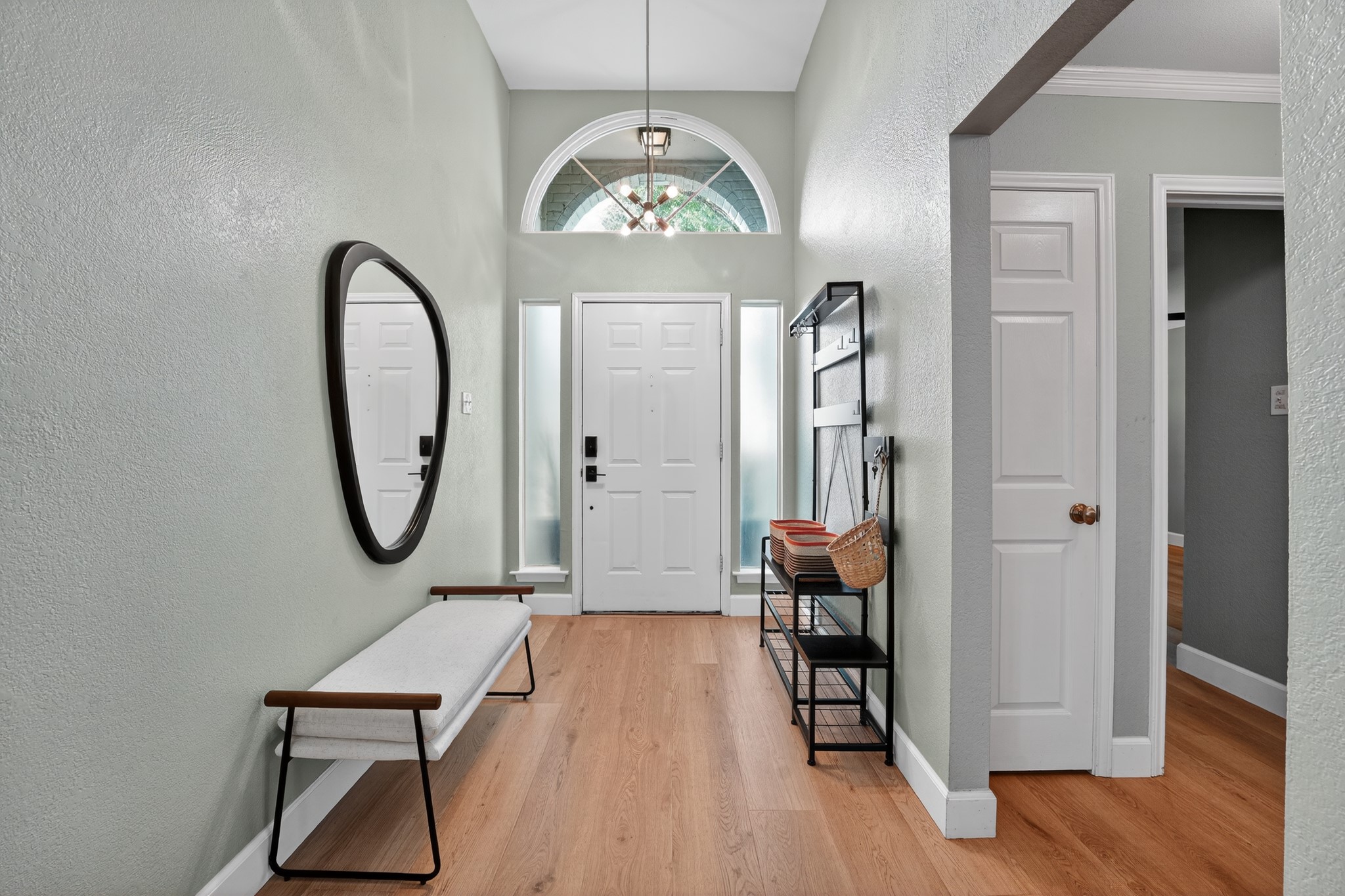 1811 Old Mill Road Cedar Park, TX 78613 - Photo 4 of 39 A welcoming entry features vaulted ceilings, rich hardwood flooring, and abundant natural light.