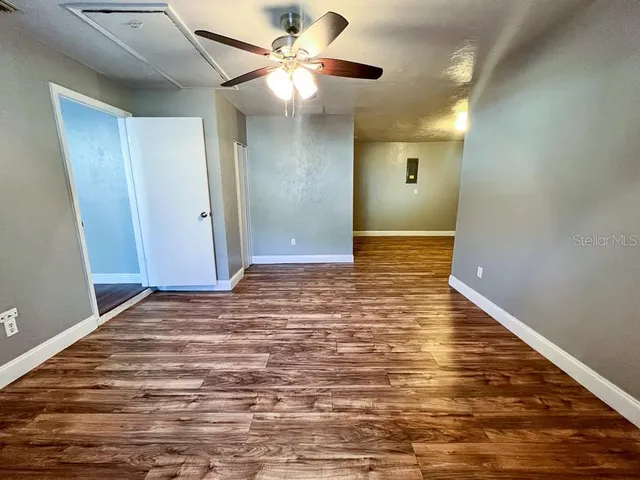 a view of walk in closet with empty racks