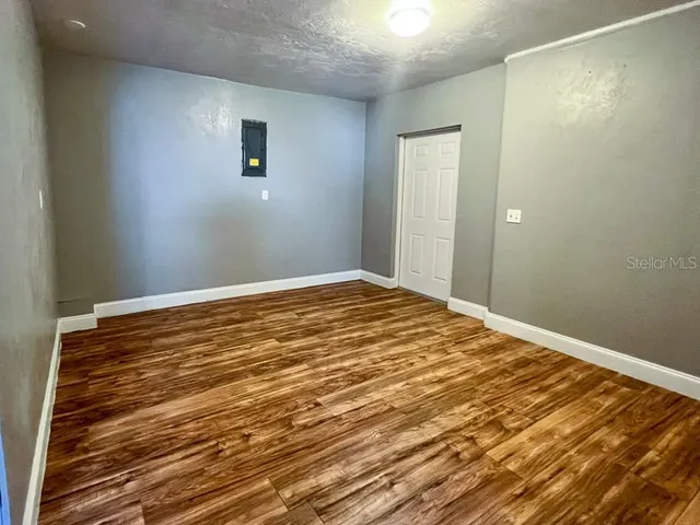 a bathroom with a toilet a sink a mirror and shower