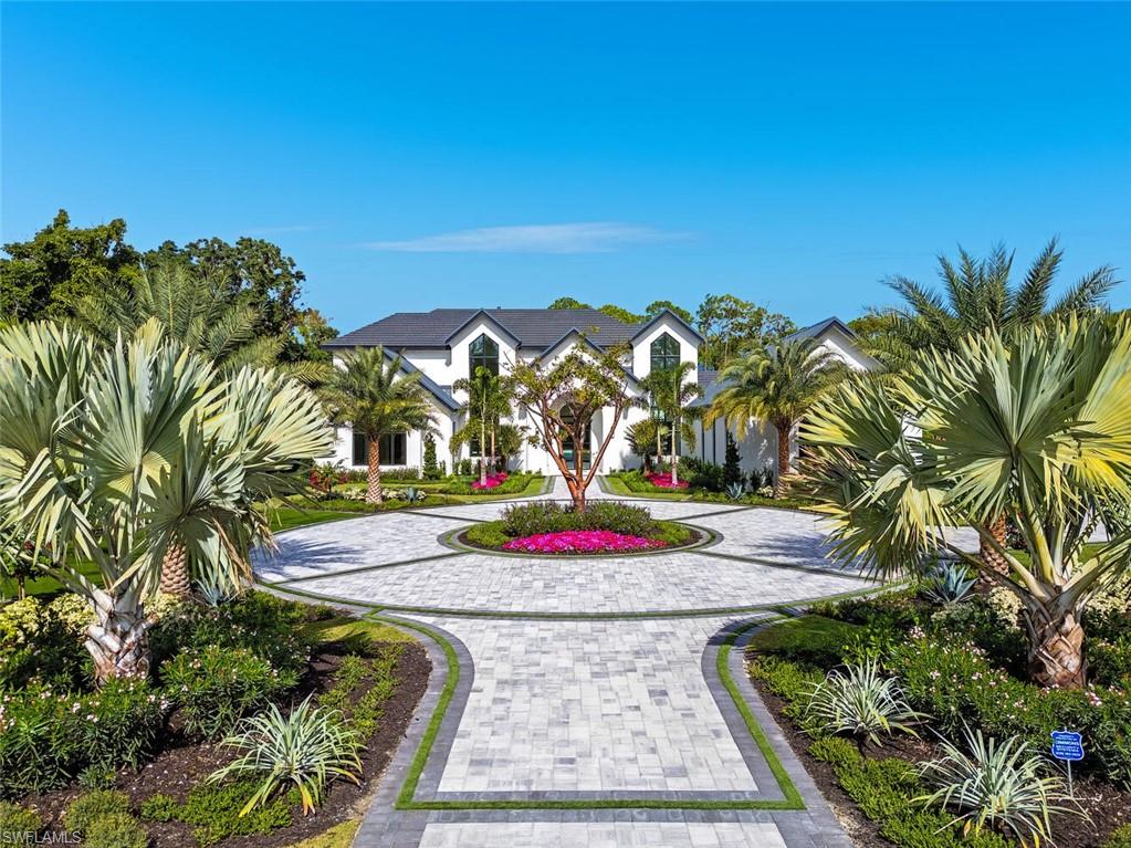 2145 Coach House Lane Naples, FL 34105 - Photo 1 of 9 a view of water fountain in front of building