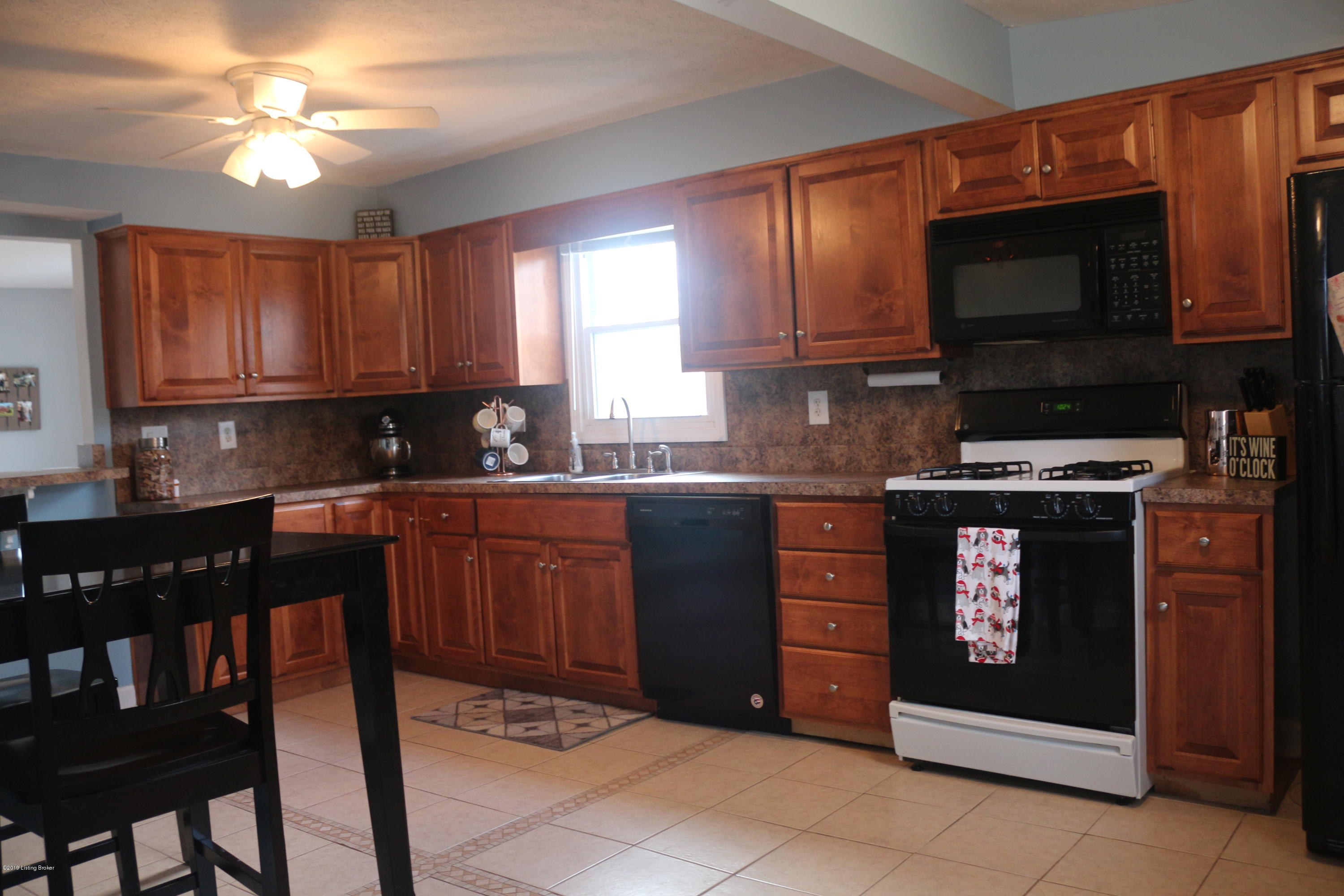 Updated cabinets with ceramic tile flooring