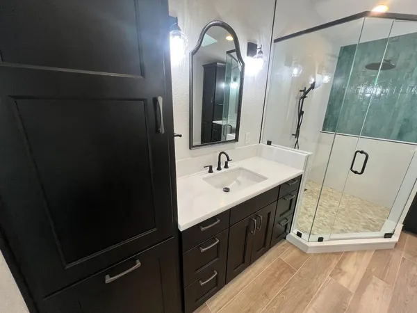 a bathroom with a sink double vanity and a mirror