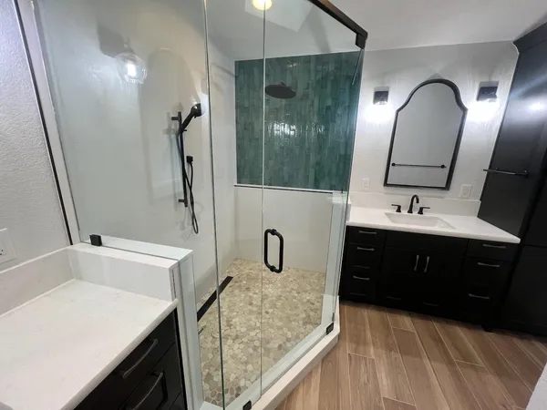 a bathroom with a sink double vanity and a mirror