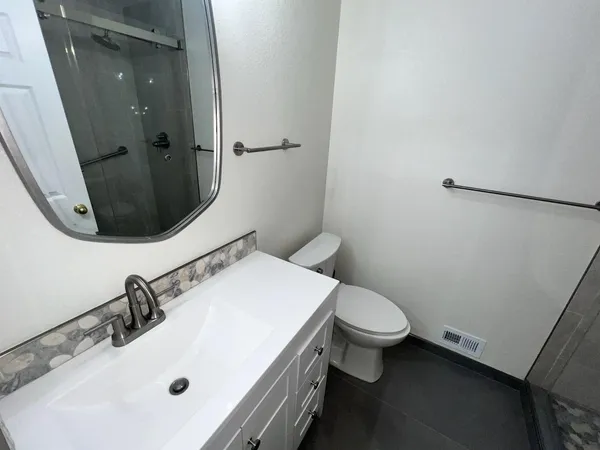 a bathroom with a sink and toilet