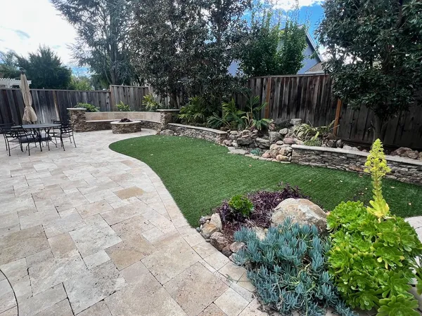 a view of backyard with sitting area and slide