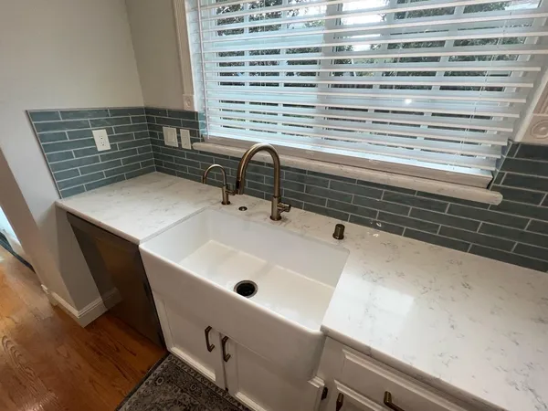 a bathroom with a sink and a window