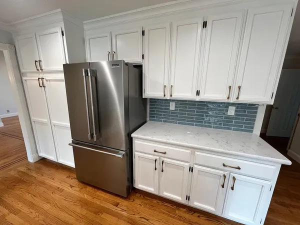 a kitchen with appliances and cabinets