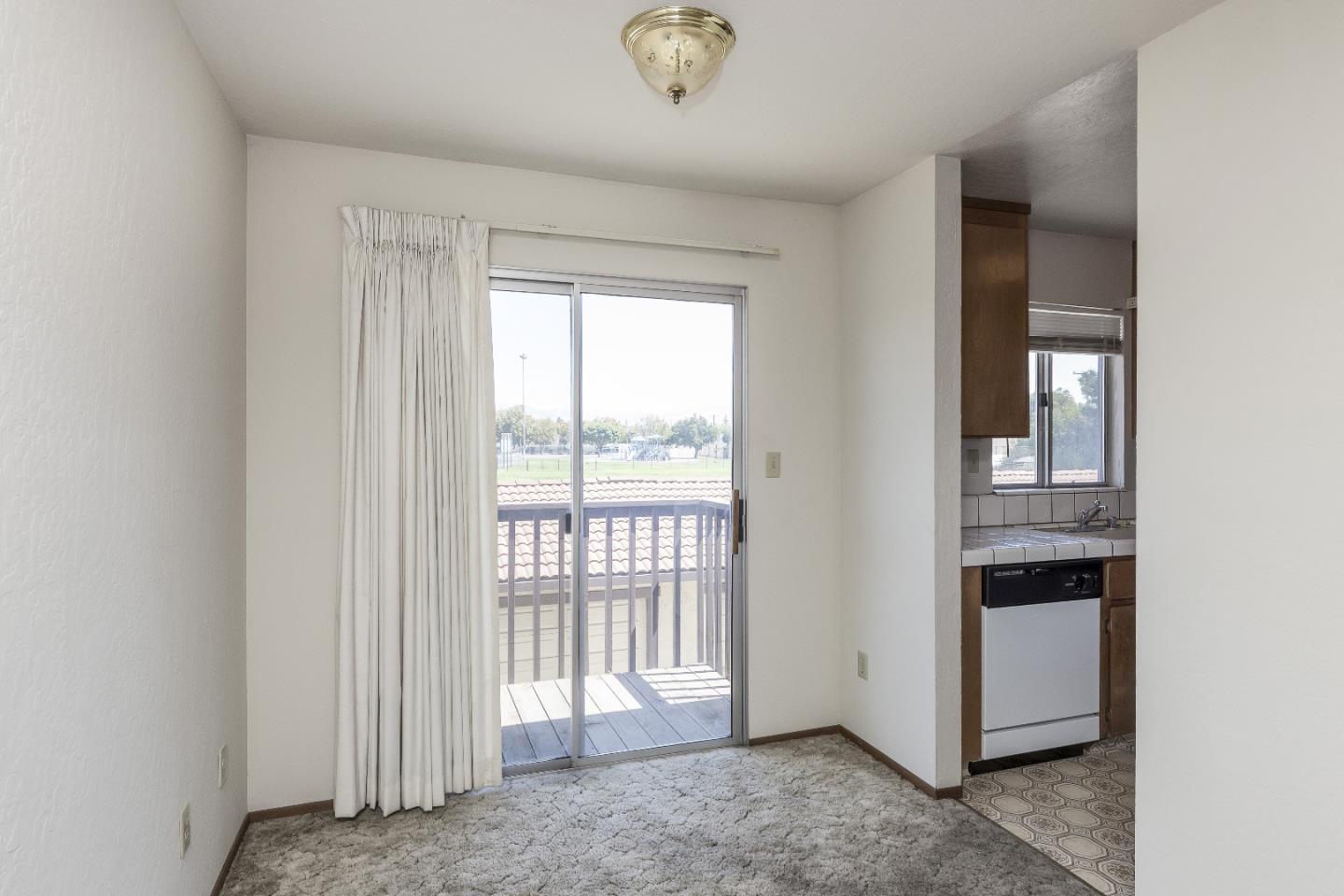 177 Monroe Street, Unit 8 Santa Clara, CA 95050 - Photo 11 of 22 a view of an empty room with a window