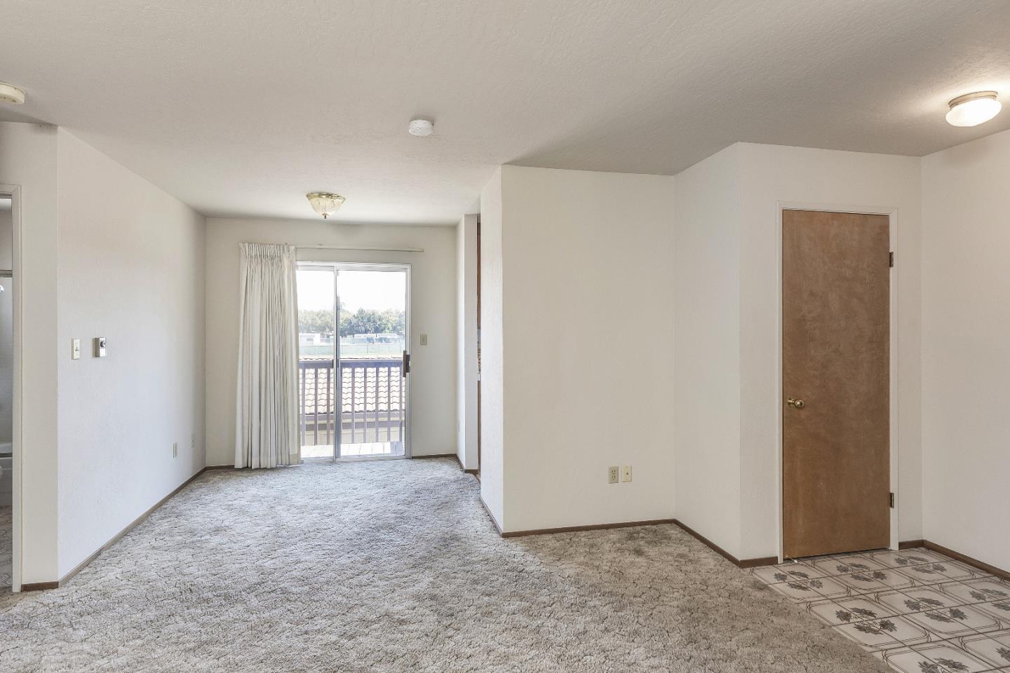 177 Monroe Street, Unit 8 Santa Clara, CA 95050 - Photo 7 of 22 a view of an empty room with a window