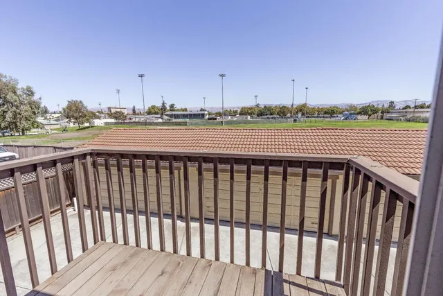 a view of balcony with furniture