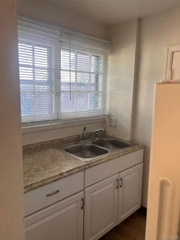 a kitchen with sink and window