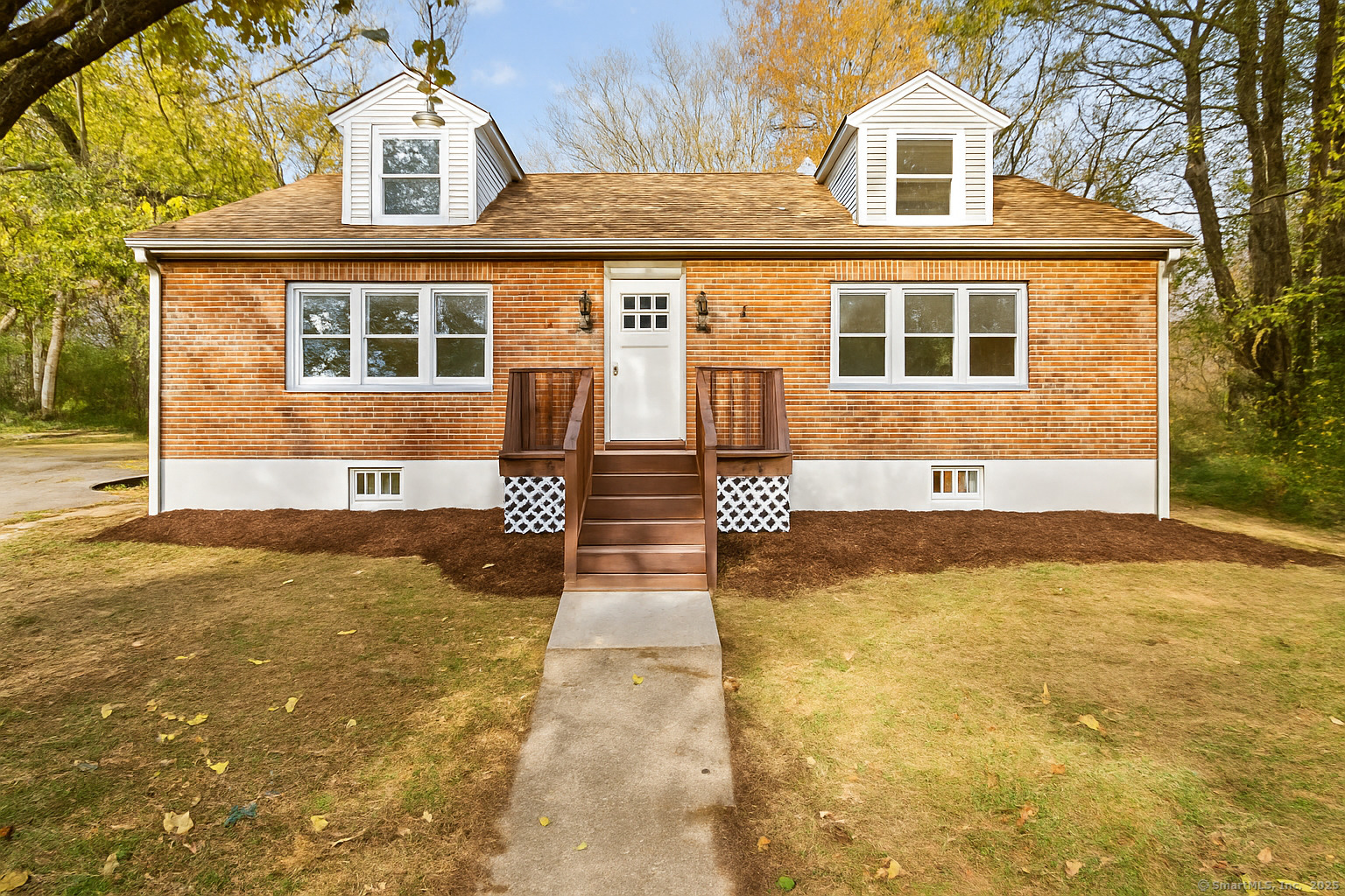 front view of a house with a yard
