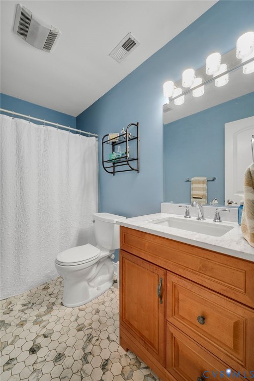 17170 Templeton Road Disputanta, VA 23842 - Photo 19 of 27 a bathroom with a sink a toilet and a mirror