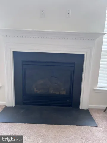 a living room with a fireplace